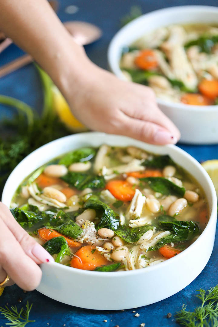 Greek Lemon Chicken Soup - A quick and easy 30 minute chicken soup - so cozy and comforting! We swap out the noodles for cannellini beans for added protein and fiber with way less calories! And the added lemon juice is so refreshing and vibrant!
