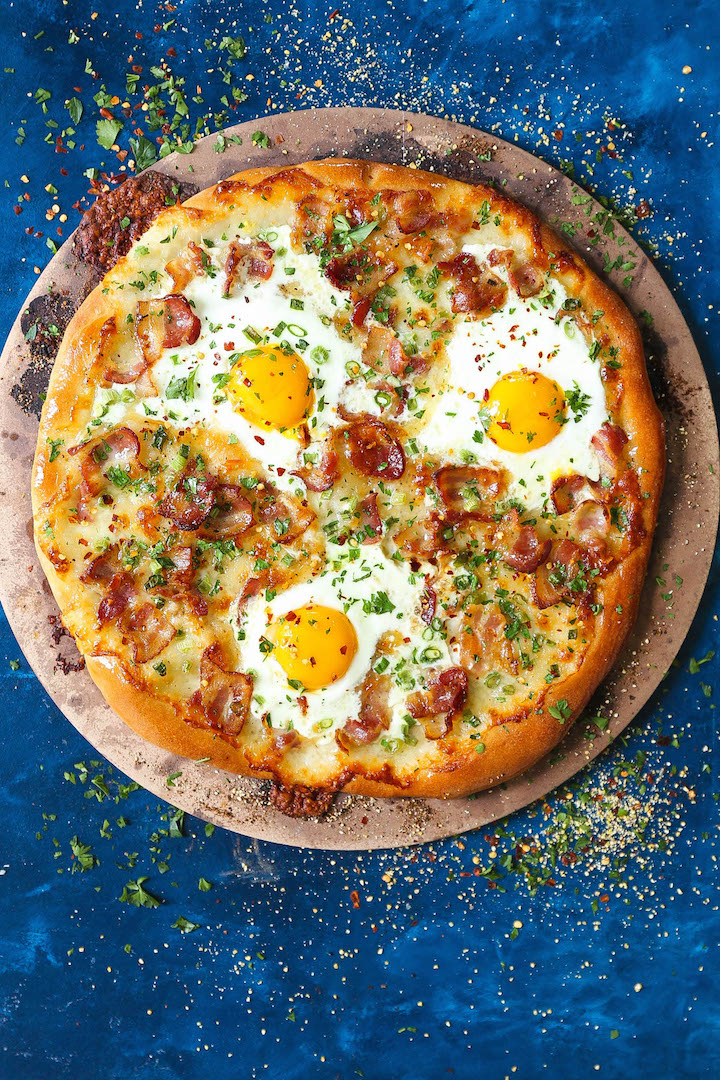 Bacon Breakfast Pizza - Your mornings just got better. It's the easiest pizza for breakfast! Loaded with crisp bacon bits, eggs and mozzarella cheese. It's breakfast at its best!