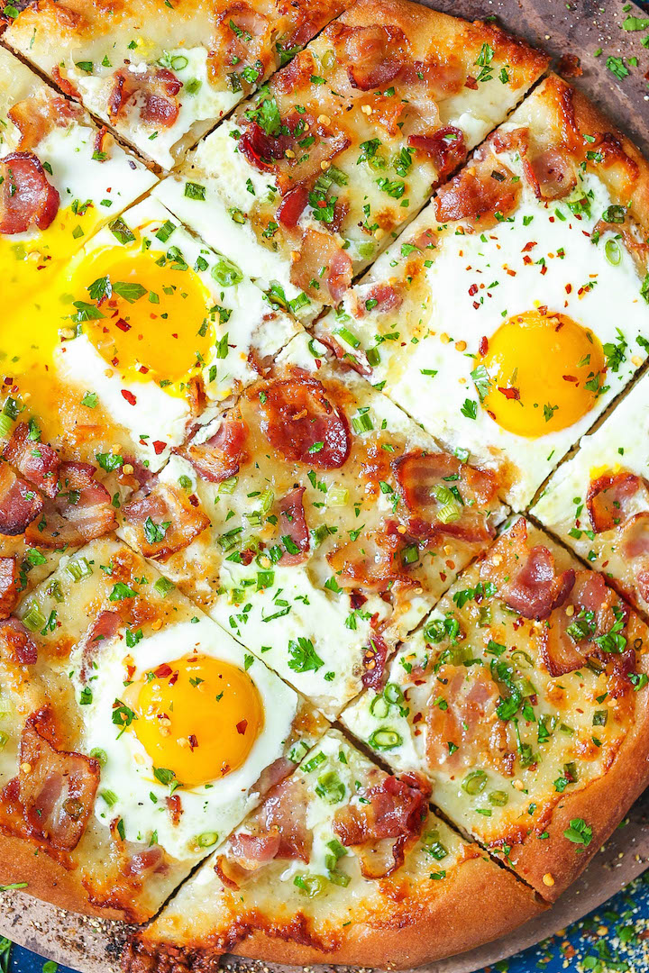 Bacon Breakfast Pizza - Your mornings just got better. It's the easiest pizza for breakfast! Loaded with crisp bacon bits, eggs and mozzarella cheese. It's breakfast at its best!