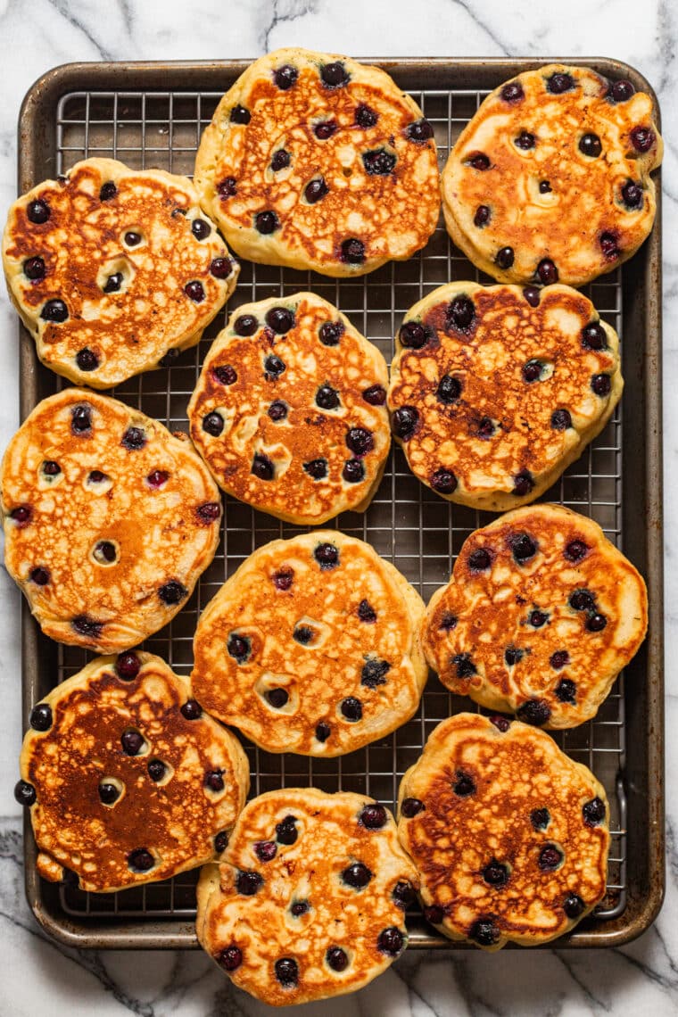 Blueberry Sour Cream Pancakes - Light, fluffy, melt-in-your-mouth buttery pancakes with juicy blueberries. Restaurant-quality right at home!