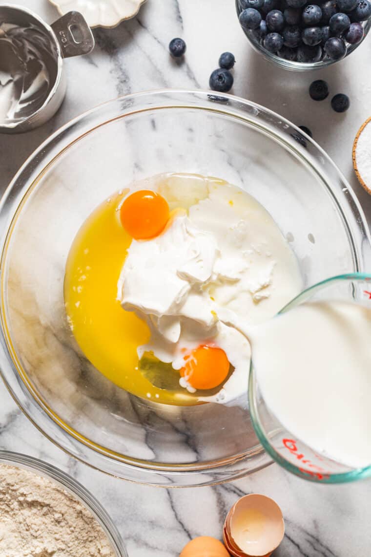 Blueberry Sour Cream Pancakes - Light, fluffy, melt-in-your-mouth buttery pancakes with juicy blueberries. Restaurant-quality right at home!