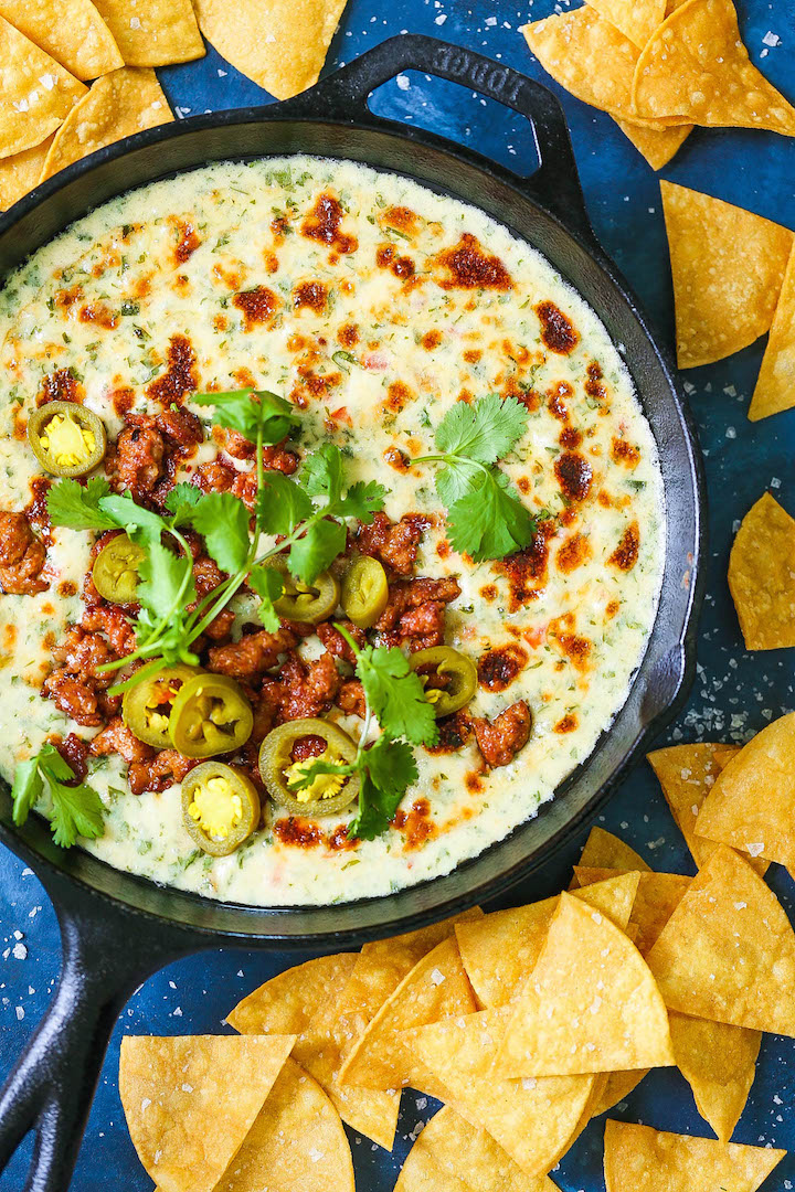 Creamy Chorizo Queso Dip - The CREAMIEST, most velvety queso EVER! Serve with tortilla chips and extra chorizo + cilantro on top! SO SO GOOD.