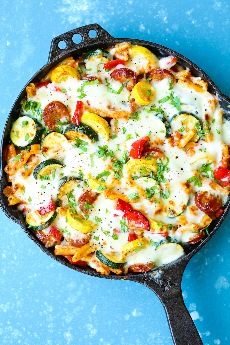 Summer Skillet Pasta - Cheesy baked pasta with sauteed garlicky summer vegetables and andouille sausage! Even your picky eaters will gobble this right up!