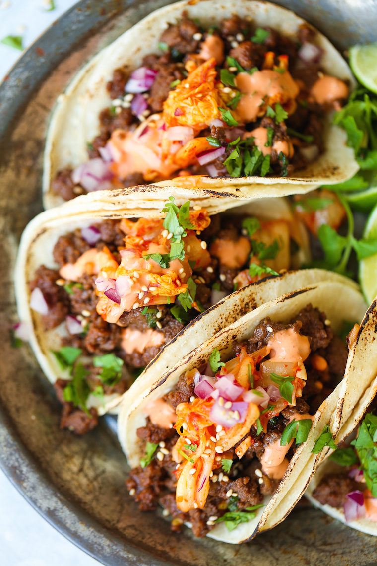Korean Beef Tacos - The most mind-blowing tacos EVER! Filled with everyone's favorite Korean beef, caramelized kimchi + Sriracha mayo!