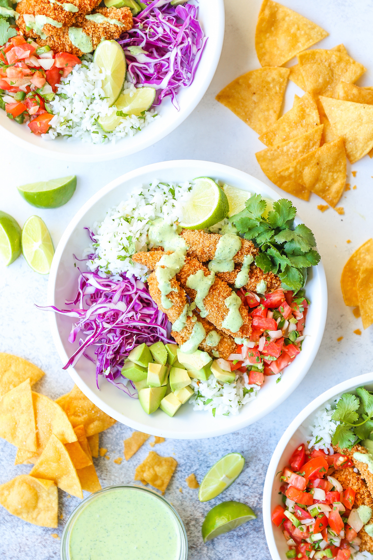 Fish Taco Bowls - The best weeknight meal! With perfectly cooked fish, cilantro lime rice, pico de gallo, avocado, and THE MOST epic cilantro lime dressing!