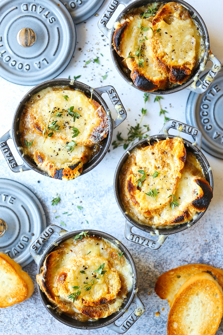 Classic French Onion Soup - Made with perfectly caramelized onions, fresh thyme sprigs, crusty baguette slices and two types of melted cheese!