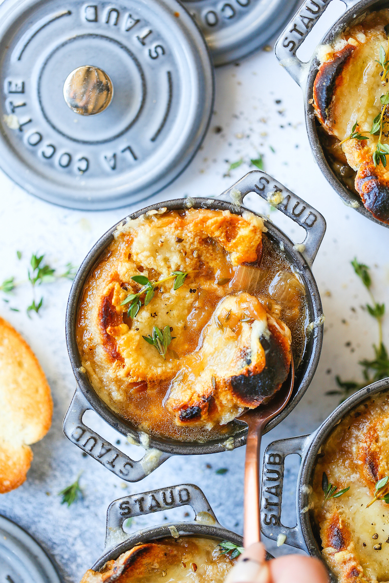 Classic French Onion Soup - Made with perfectly caramelized onions, fresh thyme sprigs, crusty baguette slices and two types of melted cheese!
