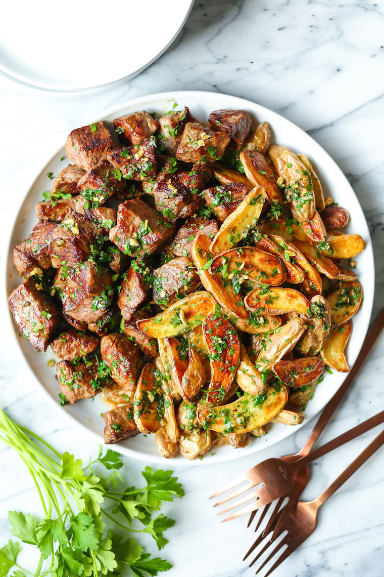 Garlic Butter Steak Bites and Fries - Perfectly garlicky and oh-so-buttery! These steak bites just melt in your mouth, paired with crisp-baked fries!