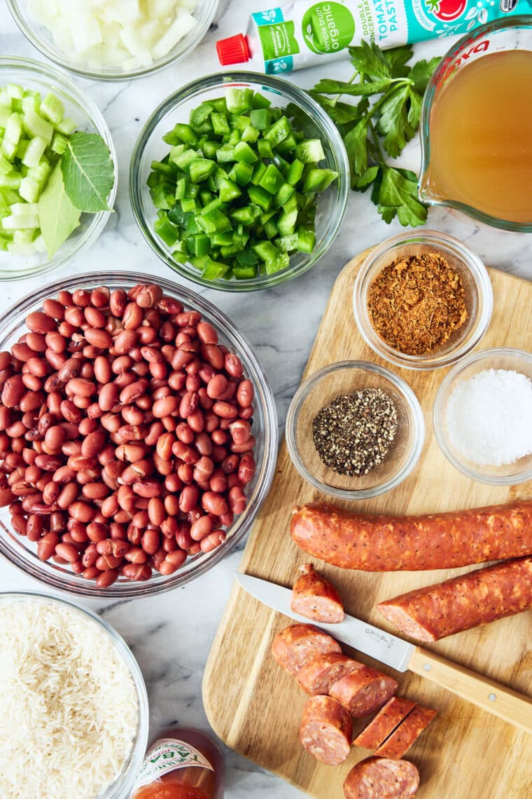 Red Beans and Rice - So thick, creamy, flavorful! Beans are cooked just right. Perfectly tender served with rice and smoky andouille sausage!