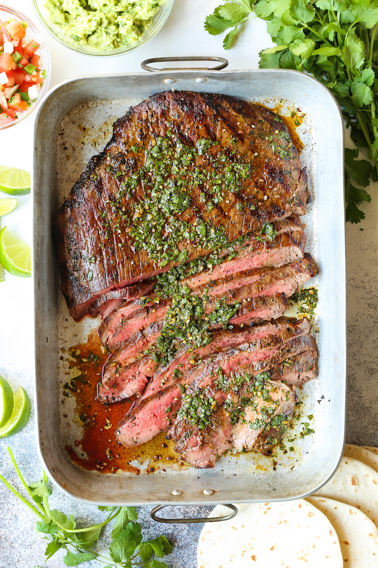 Carne Asada - Cilantro, olive oil, soy sauce, orange + lime juice, garlic, jalapeno and cumin make for the easiest and most flavorful marinade. SO SO GOOD.