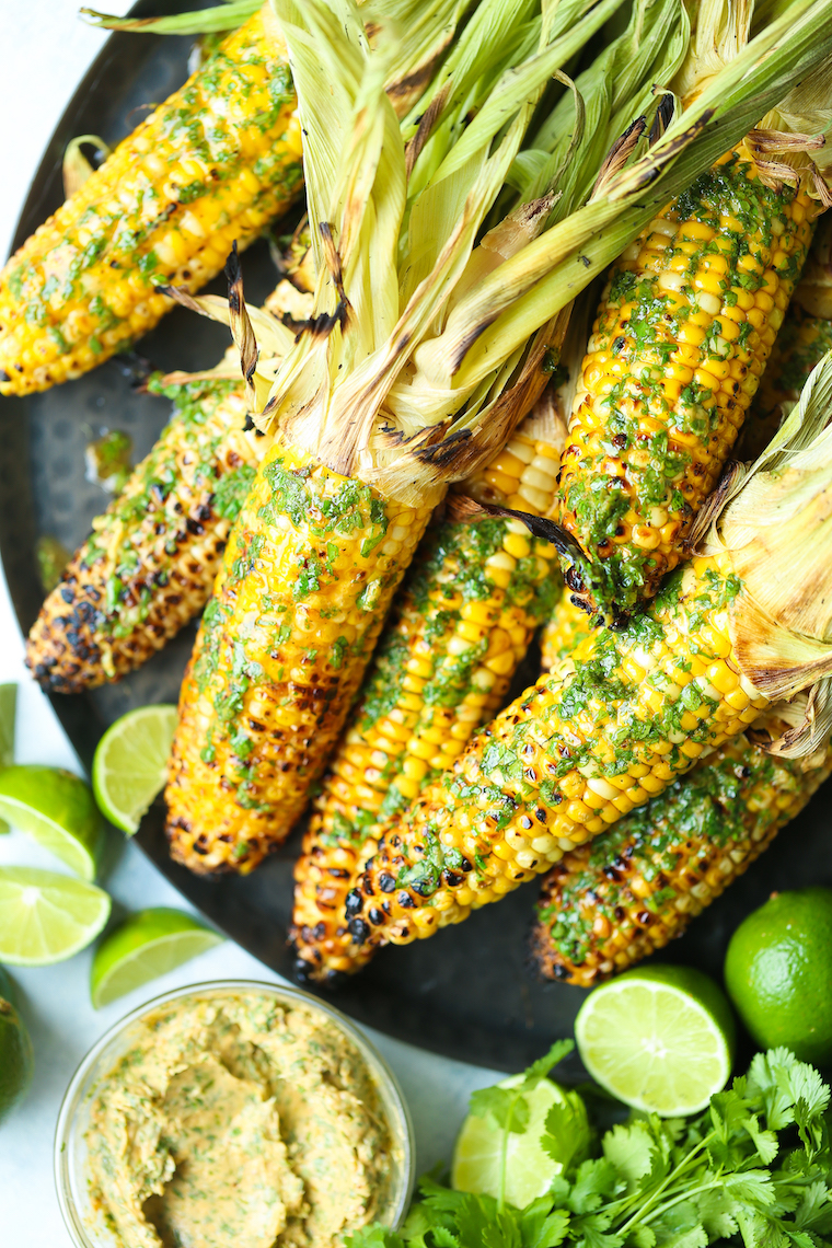 Grilled Corn with Cilantro Lime Butter - A SUMMER STAPLE! Butter, cilantro, garlic, lime, chili powder, and paprika. Option to grill or roast corn. SO GOOD!