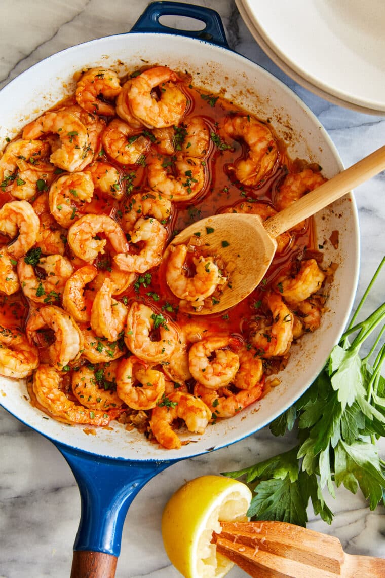 Garlic Butter Shrimp and Grits - Speedy comfort food at its best! Perfectly garlicky, buttery shrimp served with the creamiest grits!