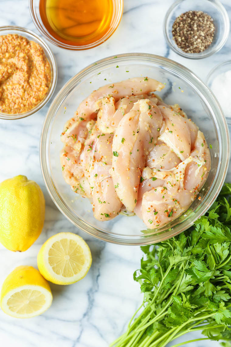 Grilled Honey Mustard Chicken Tenders - The most juicy, tender chicken with the easiest marinade. Dijon, honey, olive oil, rosemary, lemon. THE BEST EVER.