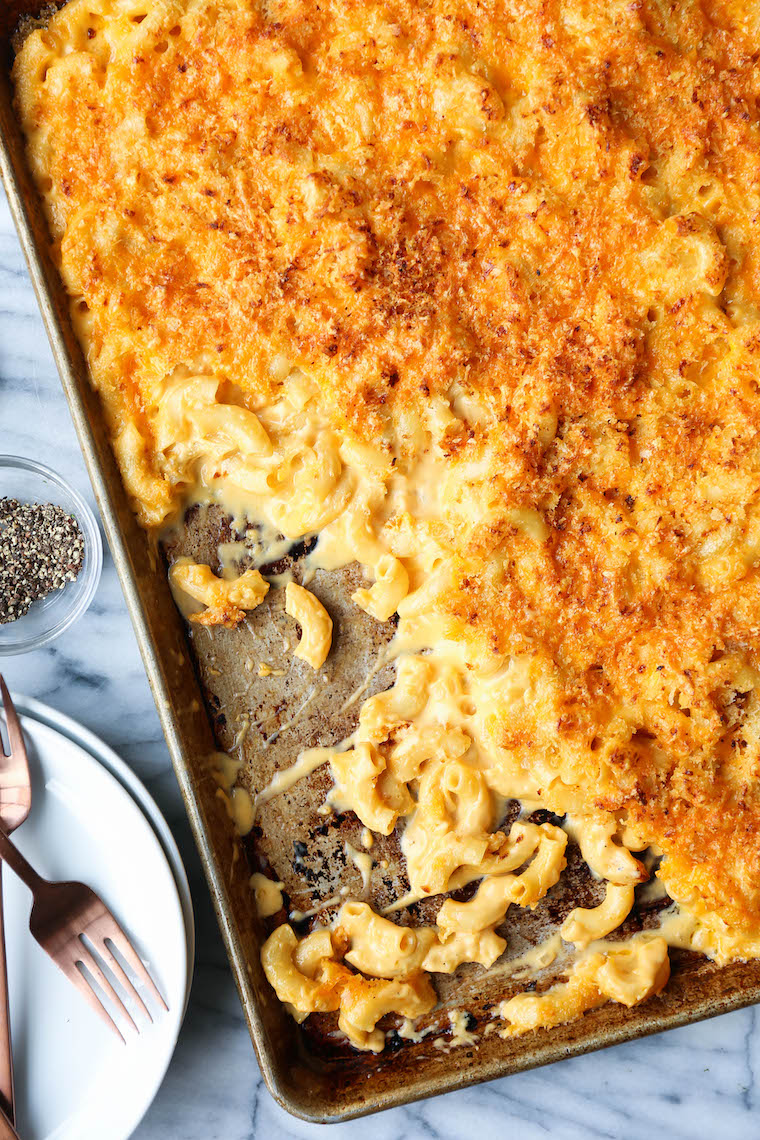 Sheet Pan Mac and Cheese - Crowd-pleasing mac and cheese made on a sheet pan! Perfectly cheesy + creamy with the maximum amount of crunchy bits. MIND BLOWN.