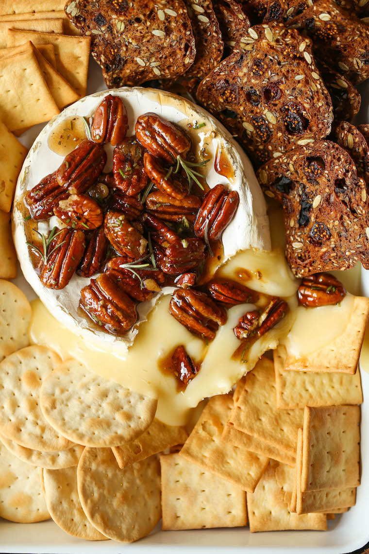 Maple Pecan Baked Brie - The easiest 5-ingredient baked brie! Served with a heavenly warm maple pecan mixture on top. SO GOOD and an absolute crowd-pleaser.