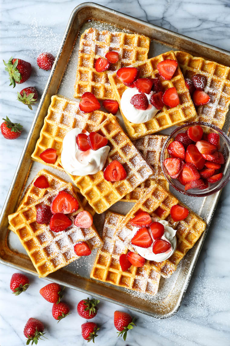 Strawberries and Cream Buttermilk Waffles - The waffles are perfectly fluffy and so light! SO GOOD. Topped with fresh strawberries + homemade whipped cream!