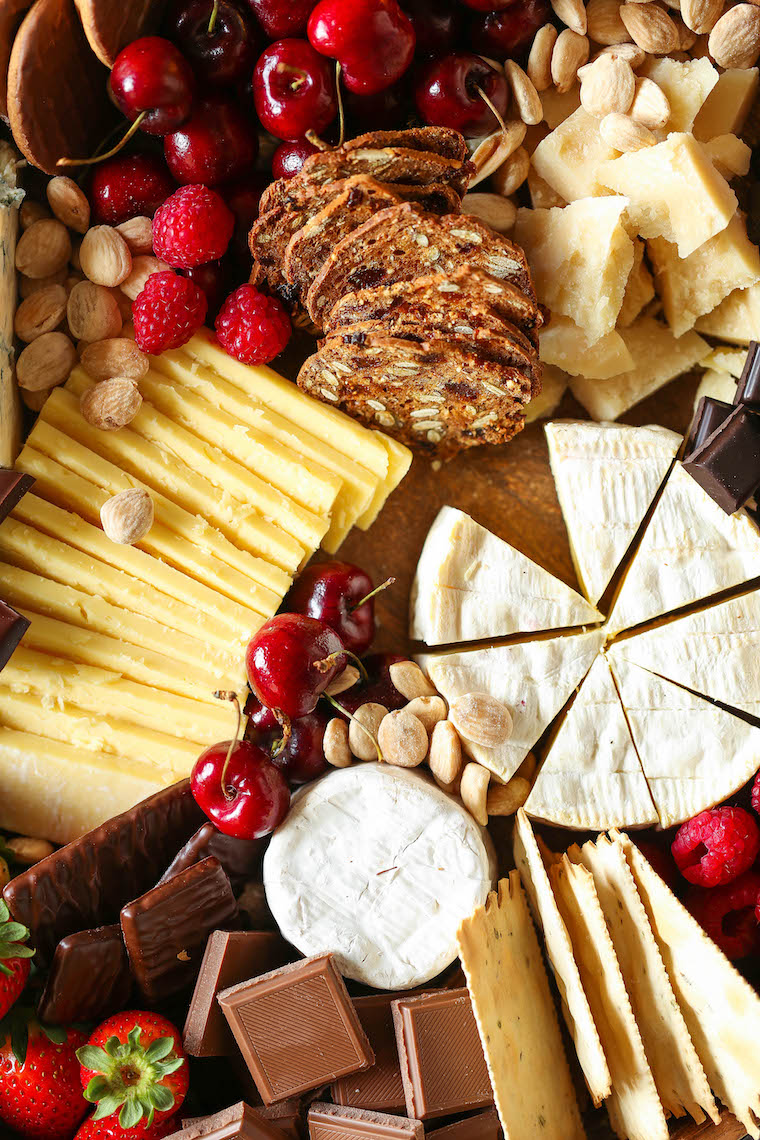 Chocolate and Cheese Board - Dark chocolate, cheeses, crackers, cherries + fresh berries. The most epic dessert cheese board for any date or get-together!