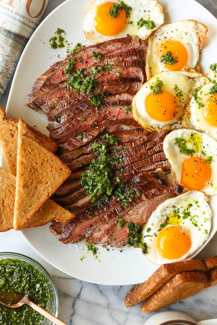 Best Ever Steak and Eggs - So quick, easy, and fancy pants without any of the hard work! Served with the most amazing herb sauce. SO SO GOOD.