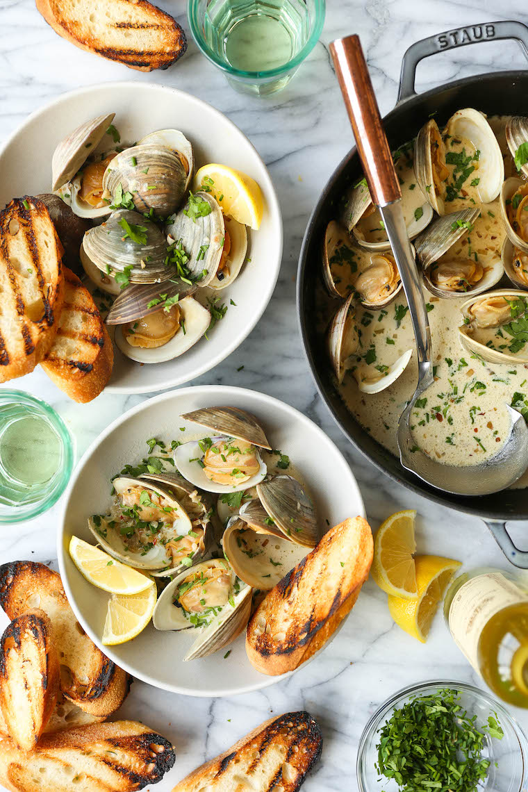 Garlic Butter Clams with White Wine Cream Sauce - The BEST steamed clams ever! So garlicky and buttery, served with a heavenly cream sauce!