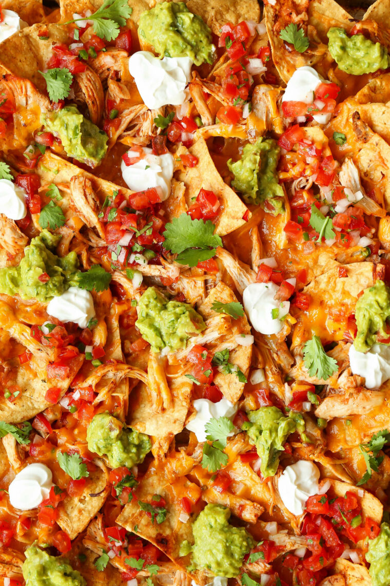 Instant Pot Chicken Nachos - Need to whip up the BEST EVER nachos for a crowd with minimal effort? THIS IS IT! Fully loaded and so so good.