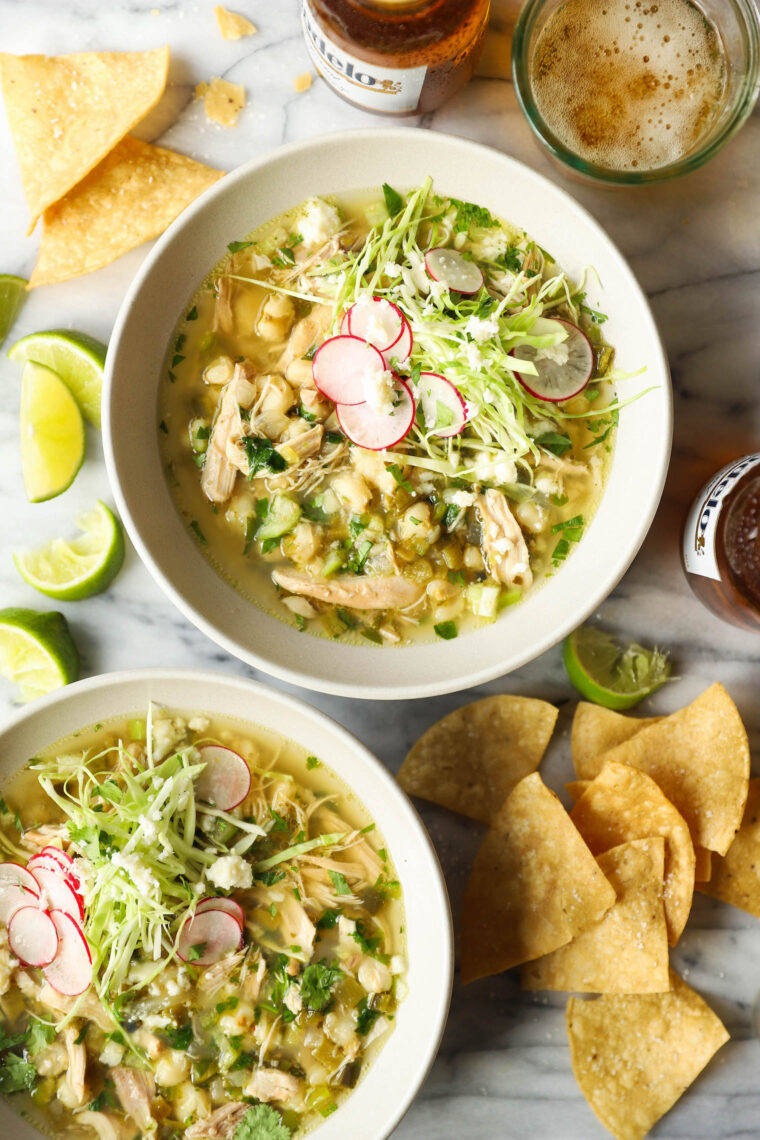 Slow Cooker Chicken Posole - Made so easily right in your crockpot! Loaded with shredded chicken, hominy and green chiles. So cozy, so good.