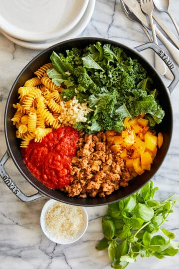 Pasta dish made from crumbled Italian sausage, fusilli pasta, torn kale, bell pepper and marinara sauce.