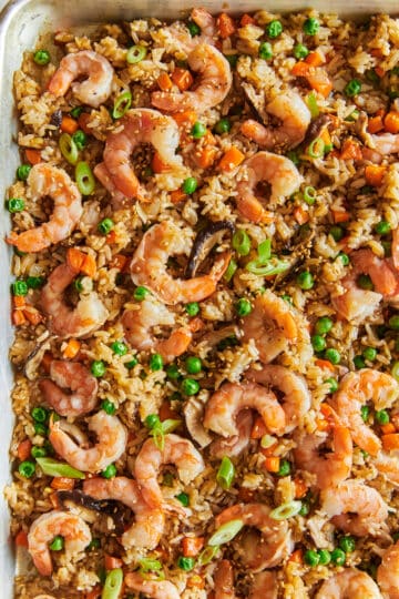Leftover rice, pan fried with cooked shrimp and peas, shiitake mushrooms, carrots, onions a sauces.