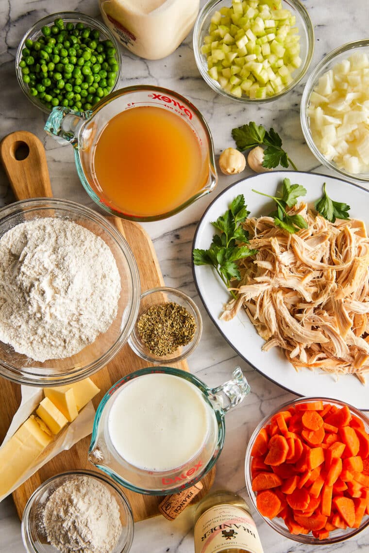 Chicken and Dumplings - A creamy, hearty chicken stew with vegetables and homemade light and fluffy dumplings! Comes together so quick too!