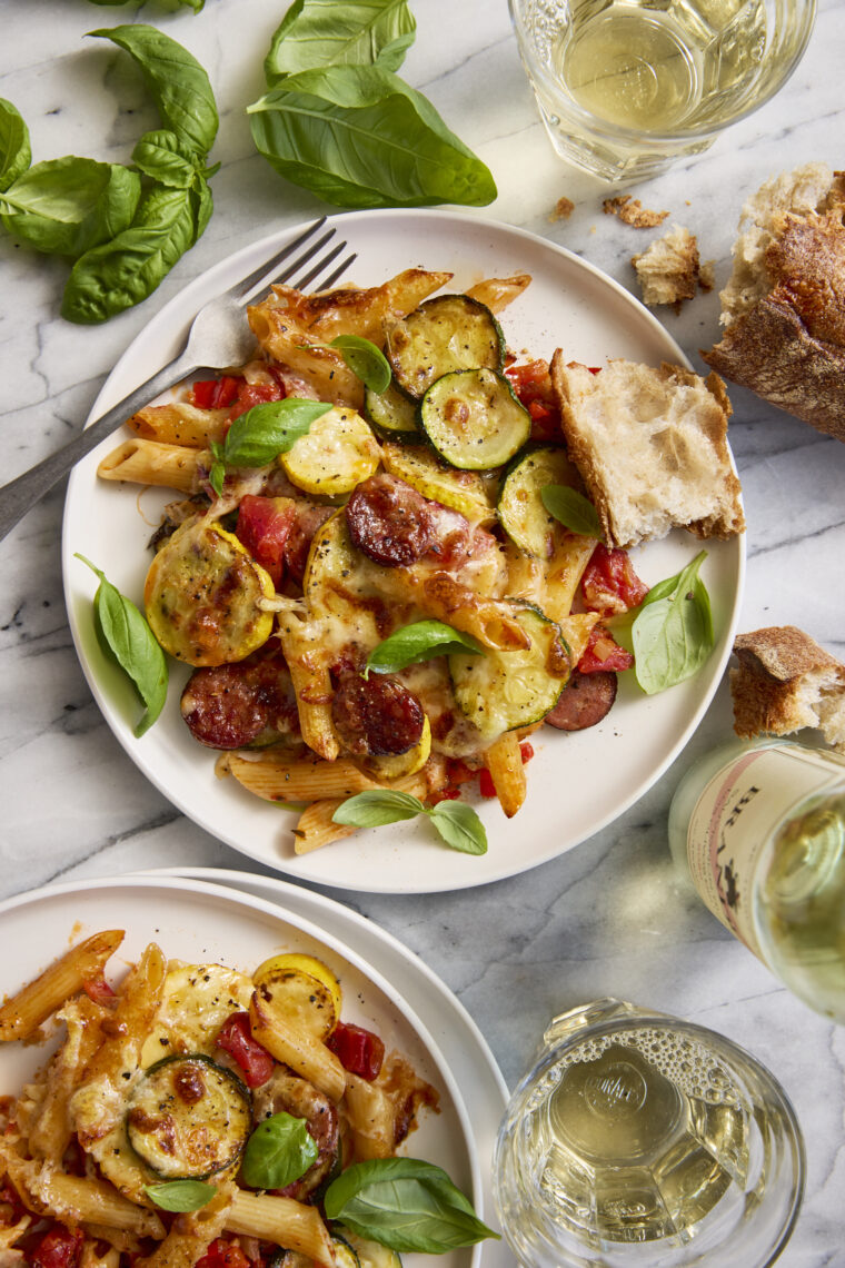 Summer Skillet Pasta - Cheesy baked pasta with the best summer vegetables and andouille sausage! Even your picky eaters will gobble this up!