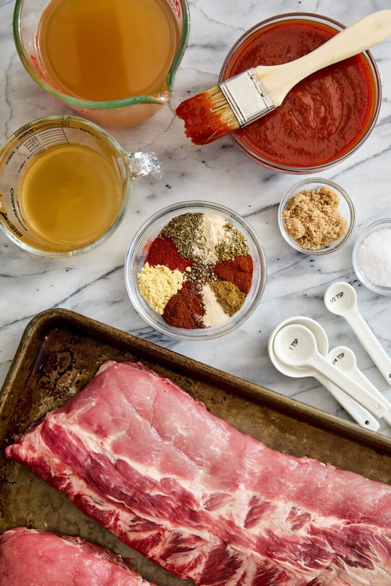 Easy Instant Pot BBQ Ribs - The easiest ribs ever made in less than 1 hr! So saucy, sticky, and tender, it just falls off-the-bone! So good.