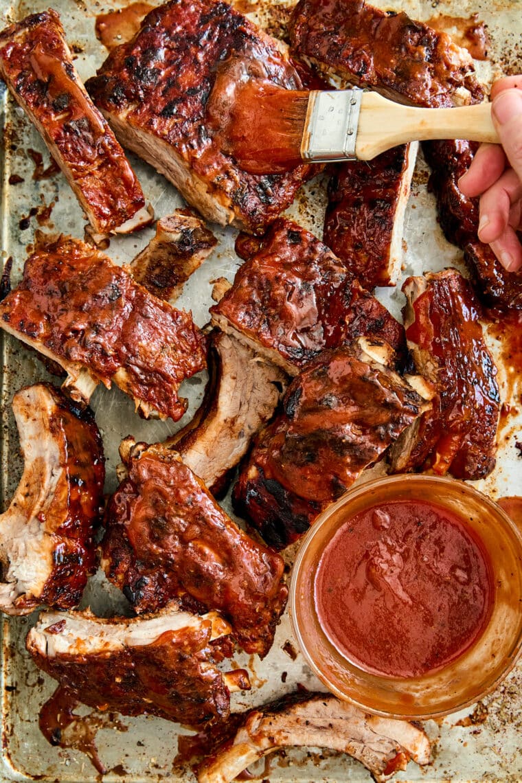 Easy Instant Pot BBQ Ribs - The easiest ribs ever made in less than 1 hr! So saucy, sticky, and tender, it just falls off-the-bone! So good.