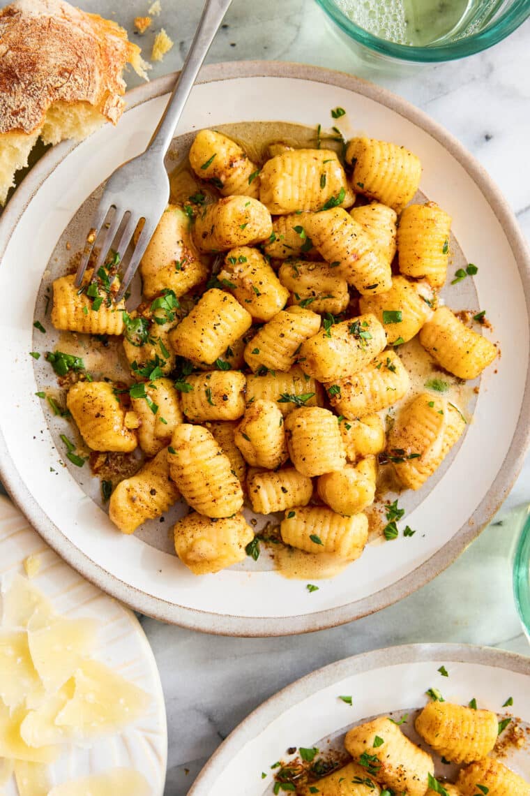 Homemade Gnocchi - Light, pillow-y, fluffy, AND SO EASY to make (just 5 ingredients!). You won't be able to go back to store-bought gnocchi!
